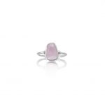 A sterling silver ring with an irregular-cut rose quartz gemstone, displayed against a white background.
